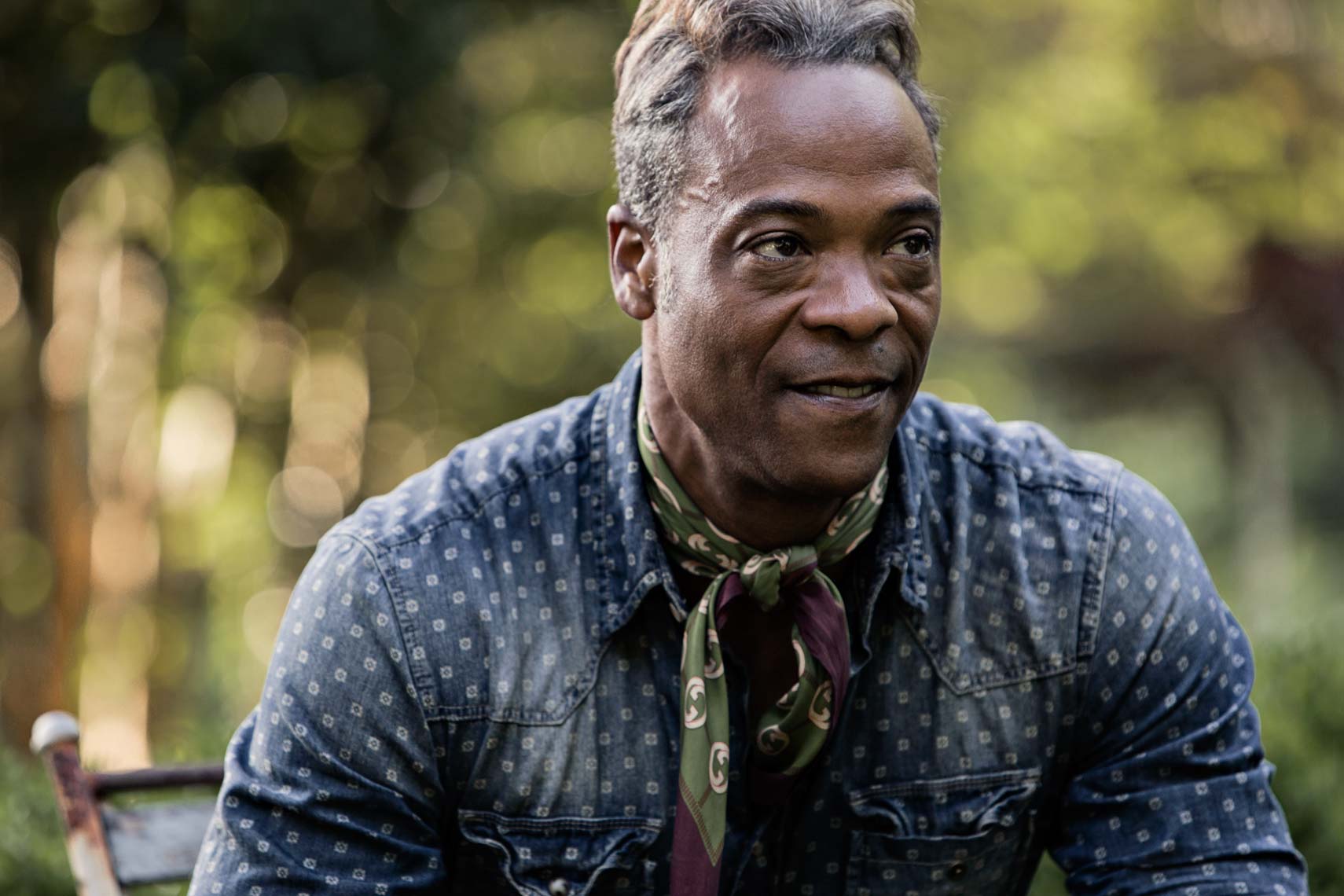 Stylish African American male in his garden by Atlanta based photographer