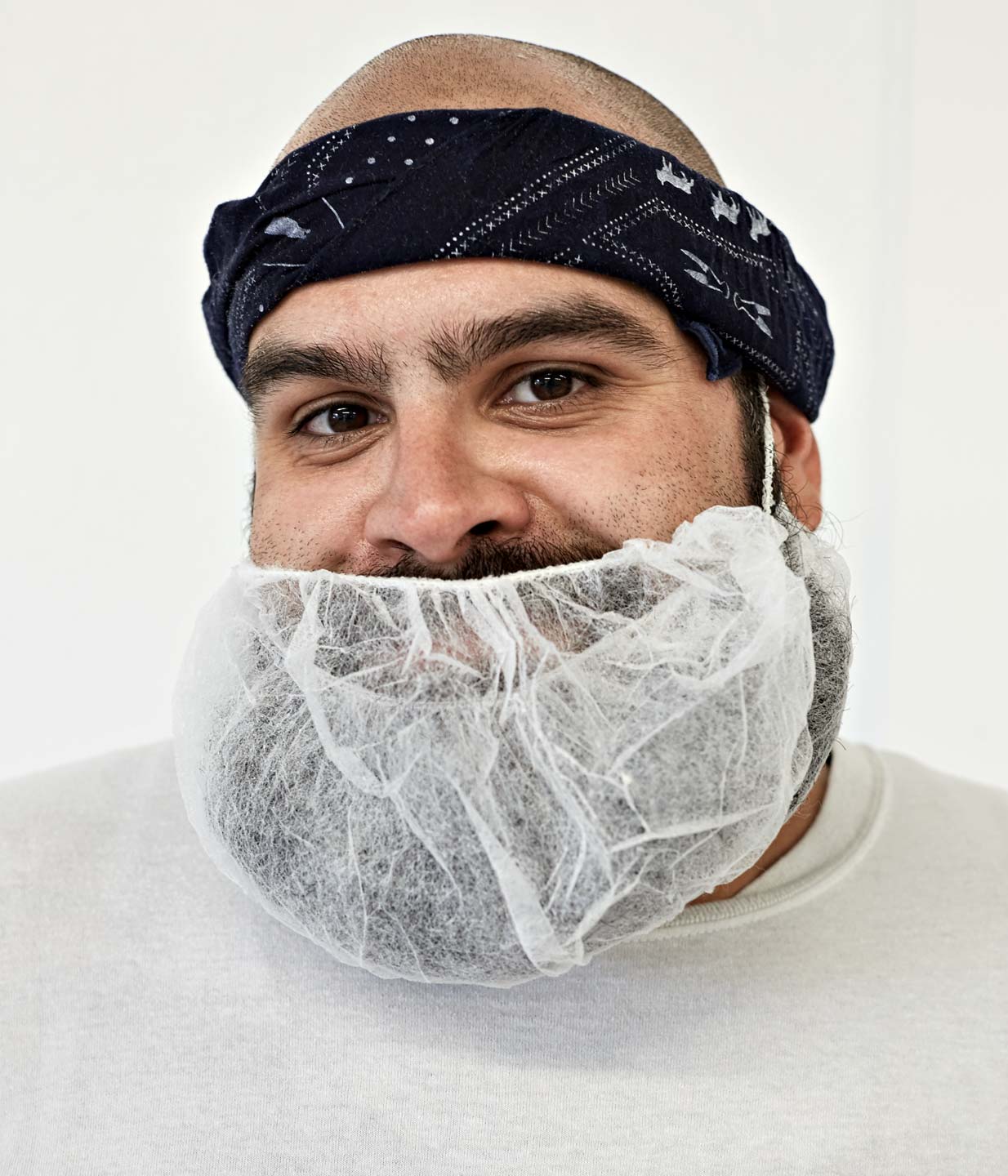 Portrait of food worker with beard net by Atlanta Photographer Nick Burchell