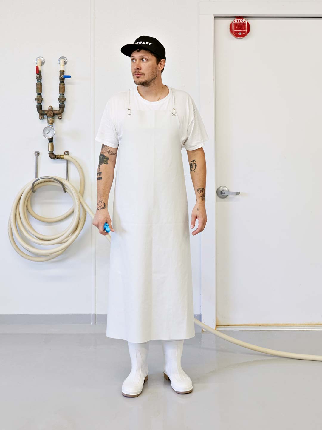  Male cheesemaker in dairy whites,  Atlanta, photography by Nick Burchell