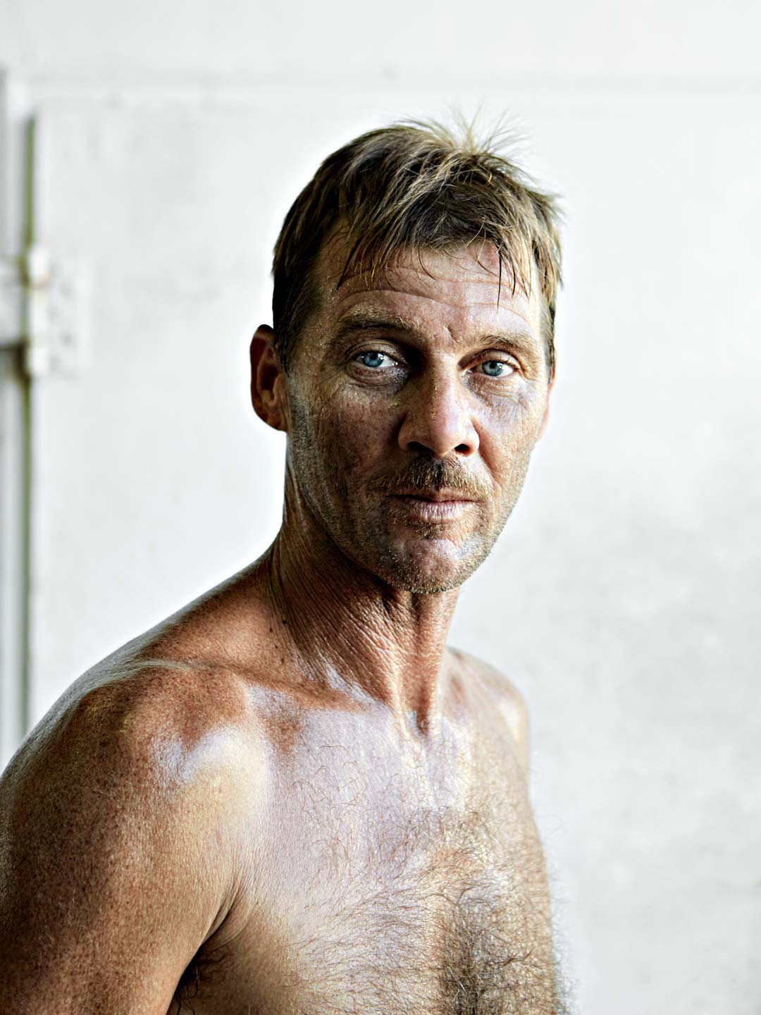 Portrait of shirtless fisherman. Nick Burchell Atlanta portrait photographer 
